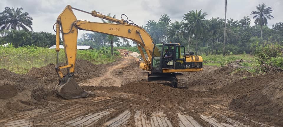 CAT excavator at work on a tropical construction site