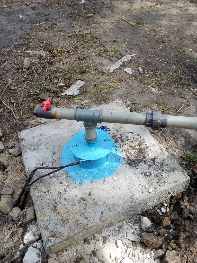 Borehole water pump headworks on a concrete pad
