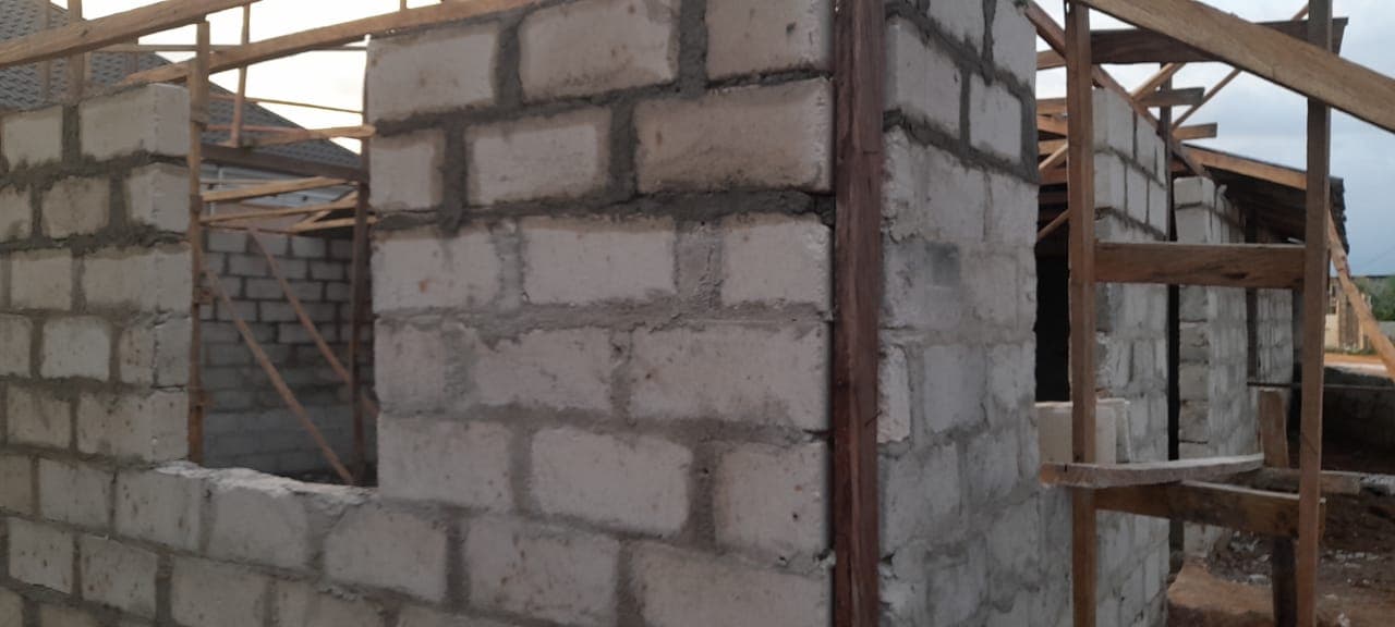 Concrete block walls with timber roof framing in progress