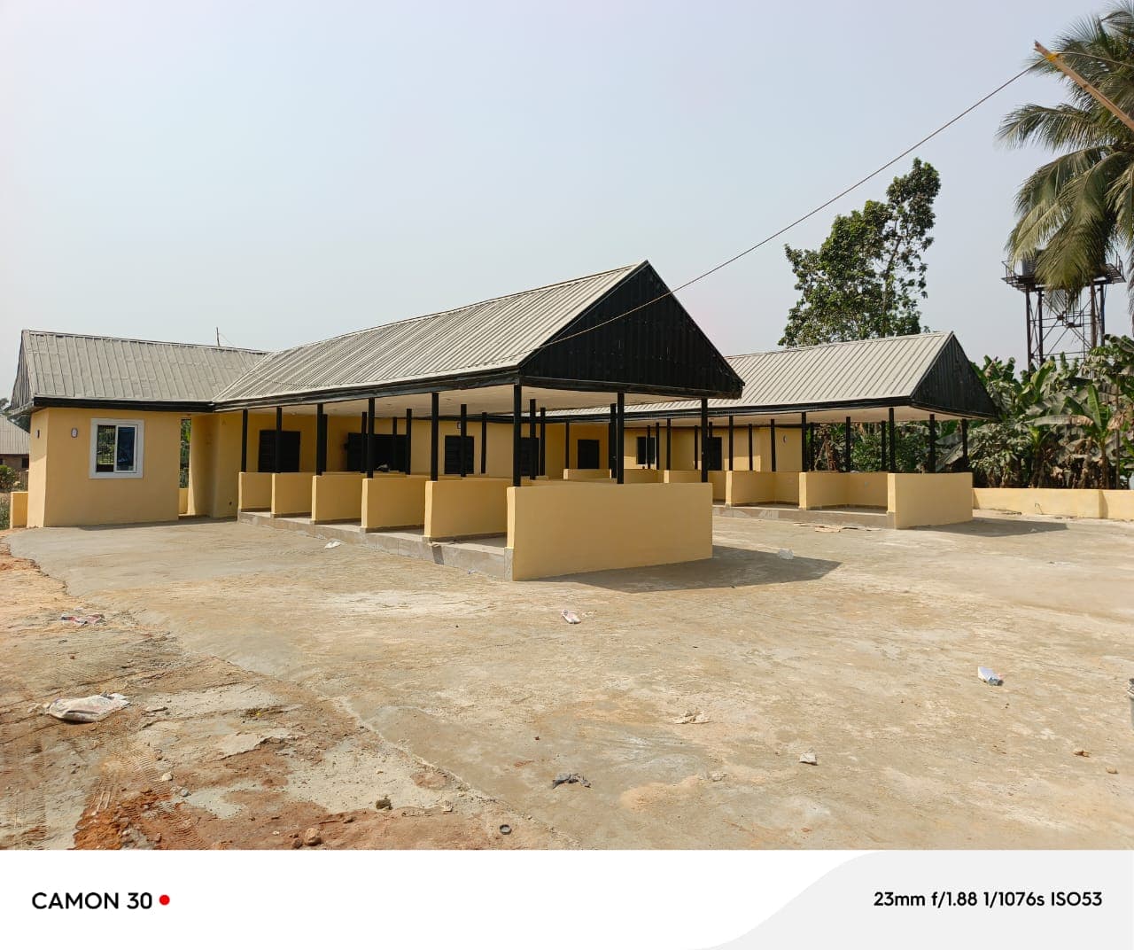 Completed facility buildings with on-site water tower